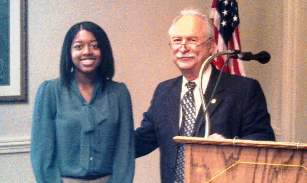 In September, Mike Schexnayder, chapter president, congratulates scholarship recipient Danielle Lewis.